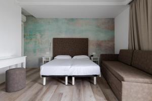 Postel nebo postele na pokoji v ubytování Hotel President