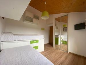 a bedroom with a bed and a mirror at Villa Poexa in Rosal
