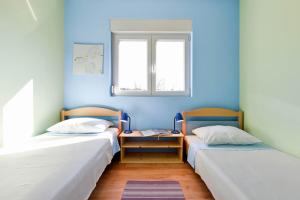 Postel nebo postele na pokoji v ubytování Paklina apartments