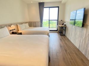 想窝11餐旅馆客房内的一张或多张床位