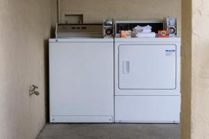 a microwave and a refrigerator in a room at Ocean Breeze Inn in Saint Augustine Beach