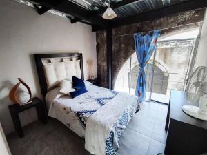 A bed or beds in a room at Casa con alberca dentro de ex-hacienda en Atlixco