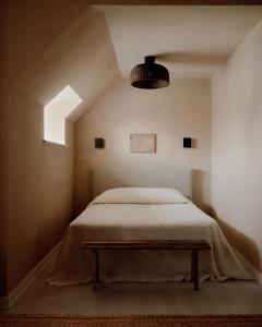 a bedroom with a bed and a table in it at The James Bradley in Bradley Beach