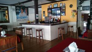 a bar in a restaurant with stools at Zen inn in Padangbai