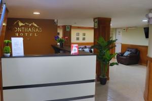 a lobby of a hotel with a reception desk at Hotel Monthañas Cajamarca in Cajamarca