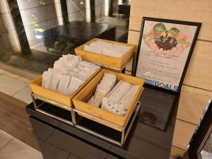 two boxes of cheese on display in a store at Hotel Grand Vert Kyu Karuizawa in Karuizawa