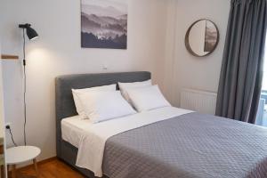 Postel nebo postele na pokoji v ubytování Oreon Suites - 'Ophelia'