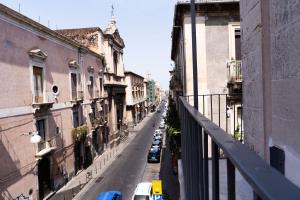 a view of a city street with cars parked on the road at Zagara e Lumia in Catania
