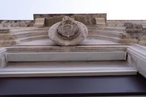 a stone shield on the side of a building at Zagara e Lumia in Catania