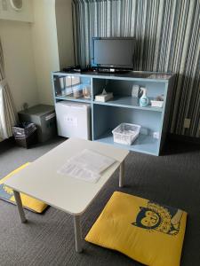 お宿 cocochiにあるテレビまたはエンターテインメントセンター