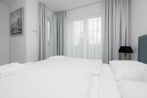 Łóżko lub łóżka w pokoju w obiekcie Apartament DIAMOND