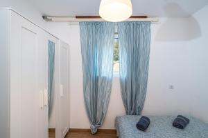 Postel nebo postele na pokoji v ubytování Apartment Sunset Rovanjska