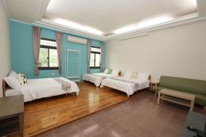 Postel nebo postele na pokoji v ubytování 小葉園民宿Little Ya B&B