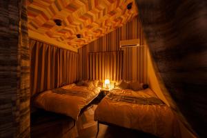 Ένα ή περισσότερα κρεβάτια σε δωμάτιο στο The miracle of blue hot spring