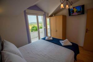 Posteľ alebo postele v izbe v ubytovaní VILLA OLEA - ŠIBENIK