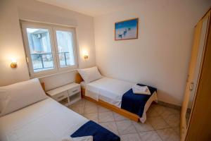 Posteľ alebo postele v izbe v ubytovaní VILLA OLEA - ŠIBENIK