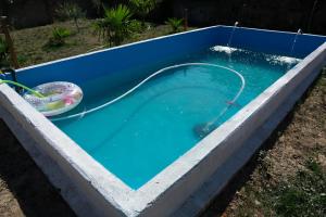 a pool of water with a hose in it at Casa rural Arribes Vida in Vitigudino
