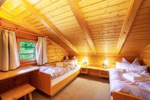 מיטה או מיטות בחדר ב-Ferienhaus byveronika