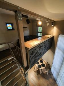 a room with a bunk bed and a staircase at Kotedža “Saules osta” in Saulkrasti +11 photos