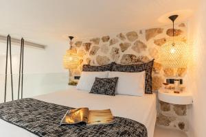 Postel nebo postele na pokoji v ubytování Naxian Spirit Inn