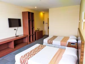 מיטה או מיטות בחדר ב-MADISON PARK HOTEL