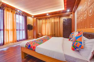 a bedroom with a bed on a boat at FabExpress Sapphire in Mussoorie