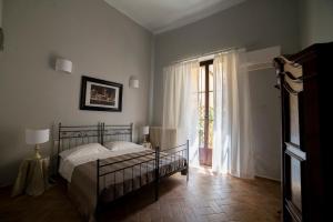 Postel nebo postele na pokoji v ubytování Hotel Torre Guelfa Palazzo Acciaiuoli
