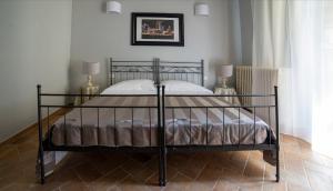 Postel nebo postele na pokoji v ubytování Hotel Torre Guelfa Palazzo Acciaiuoli