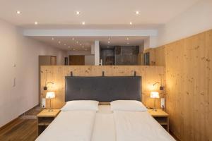 Posteľ alebo postele v izbe v ubytovaní ArlBerglife Ferienresort