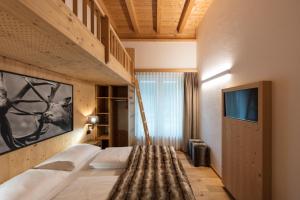 Posteľ alebo postele v izbe v ubytovaní ArlBerglife Ferienresort
