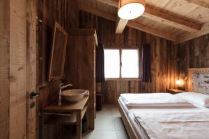 Posteľ alebo postele v izbe v ubytovaní ArlBerglife Ferienresort