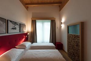 Posteľ alebo postele v izbe v ubytovaní ArlBerglife Ferienresort