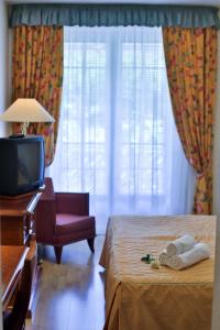 Postel nebo postele na pokoji v ubytování Hotel Rittinger