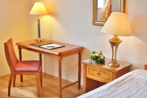 Postel nebo postele na pokoji v ubytování Hotel Rittinger