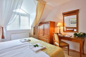 Postel nebo postele na pokoji v ubytování Hotel Rittinger