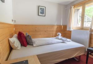Postel nebo postele na pokoji v ubytování Hotel Le Refuge