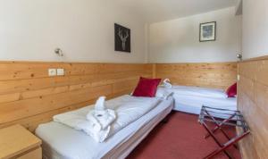 Postel nebo postele na pokoji v ubytování Hotel Le Refuge