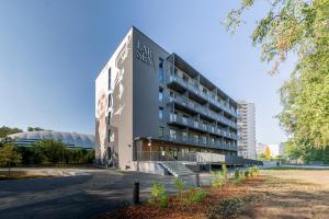 a building with a sign on the side of it at Rocca House by Larsen in Tallinn