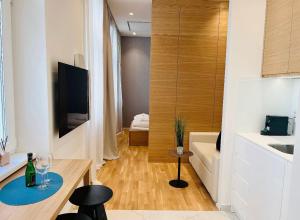Televízia a/alebo spoločenská miestnosť v ubytovaní ZEUS Design Apartment Erlach #62