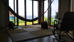 Postel nebo postele na pokoji v ubytování 日本海 能生の宿 見晴らし亭