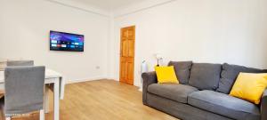 a living room with a couch and a table at Neptune Flat 9 at Marble Arch in London