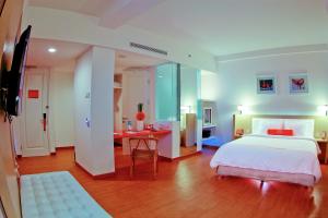 Voodi või voodid majutusasutuse HARRIS Hotel & Conventions Malang toas