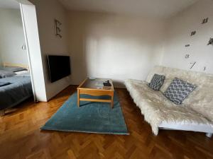 a living room with a couch and a table at Do Gdyni in Gdynia +22 photos