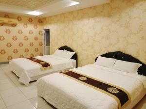 Giường trong phòng chung tại HOTEL Bồ Câu