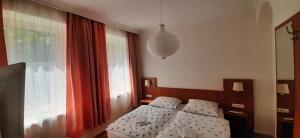 Postel nebo postele na pokoji v ubytování Schillers Landhaus