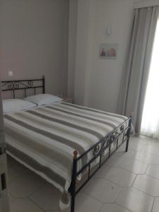 Postel nebo postele na pokoji v ubytování Alkyon Hotel