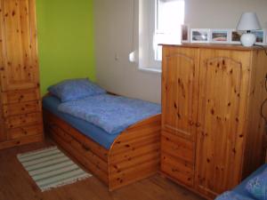 a small bedroom with a bed and a window at Ferienhaus Silvia 