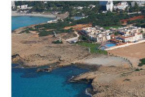 an aerial view of a beach next to the water at Aktea Beach Village in Ayia Napa