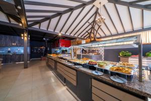 a buffet line with many different types of food at Lykia Botanika Beach Fun & Club - All Inclusive in Fethiye