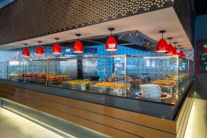 a buffet line of food in a restaurant at Lykia Botanika Beach Fun & Club - All Inclusive in Fethiye